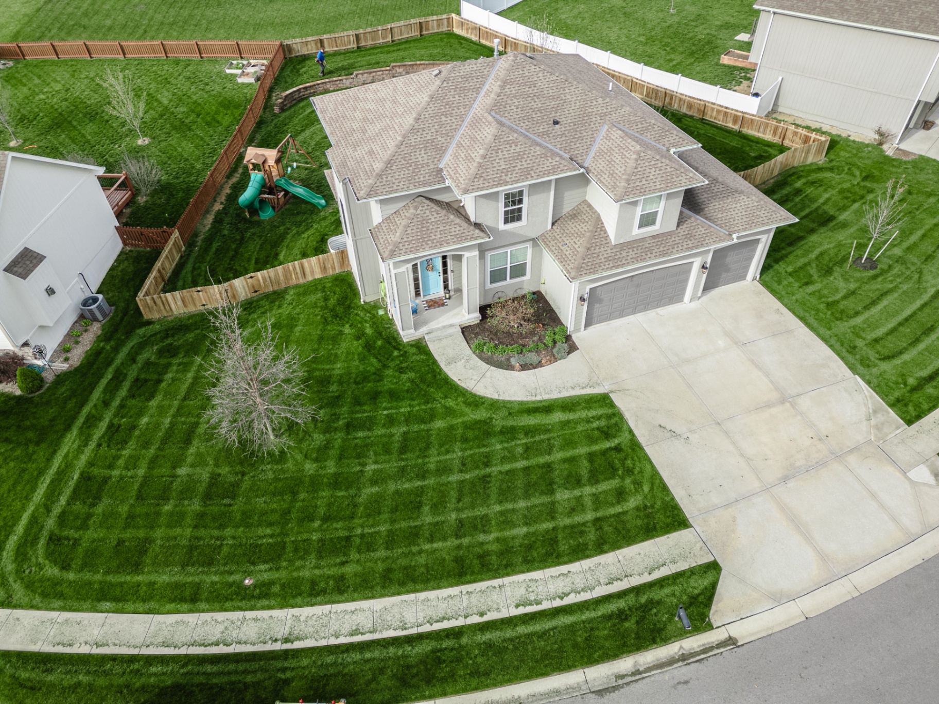 Aerial view of a Kansas City lawn where mole and vole damage would be visible